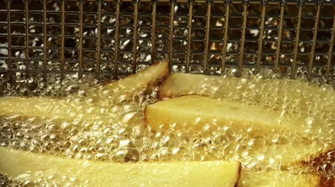 Deep-frying chips (close-up) Stock Footage 8571819