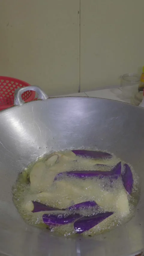 Deep frying eggplant with sounds Stock Footage 318603959