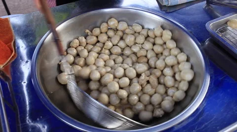 Deep frying fishball in the pan Stock Footage 67872243