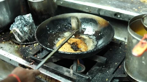 Deep frying Indian bread. Stock Footage 131702433