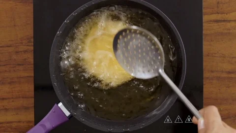 Deep Frying Kachori-Top-angle shot Stock Footage 80454393