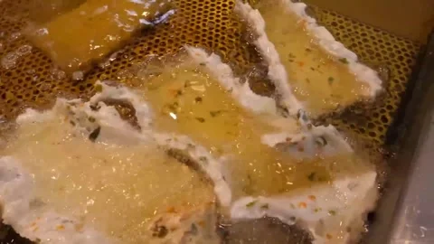 Deep Frying Korean Fish Cakes in Hot Oil Stock Footage 337375024
