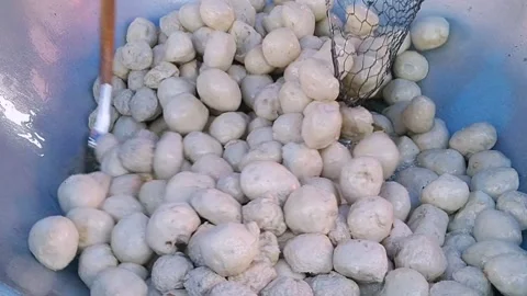 Deep Frying Many Bakso Meatballs in Boiling Hot Oil Stock Footage 340490865