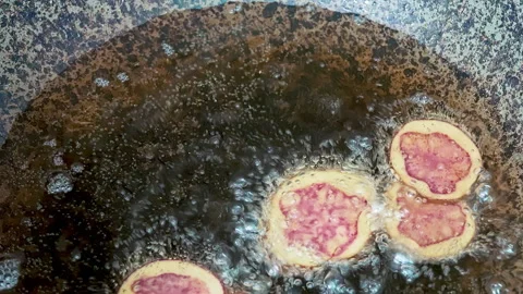 Deep frying native Peruvian potato slices. Video stock 341440040