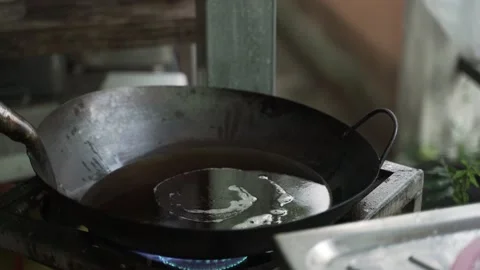 Deep frying oil cooking process Stock Footage 165679831
