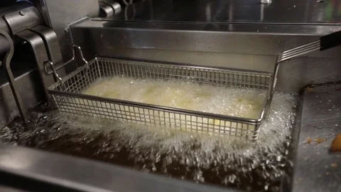 Deep frying potatoes Stock Footage 83008144