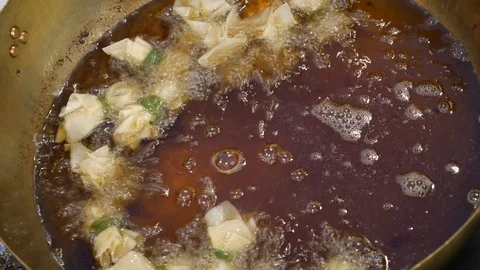 Deep frying Thai dessert Stock Footage 106939932