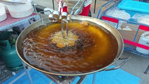 Deep Frying Traditional Snack in Big Pan. Stock Footage 340549538