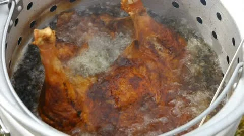 Deep frying Turkey Stock Footage 10730404