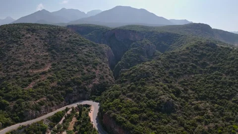 Deep Gorge and Winding Road Above Foneas Beach in Greece Stock-Footage 335376832