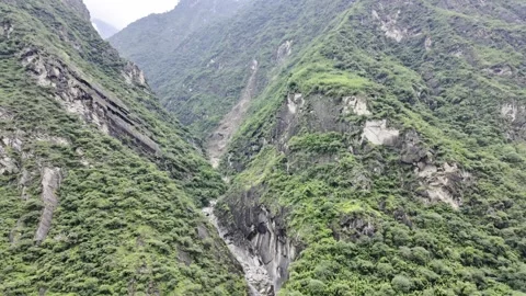 Deep Gorge with Arch Bridge and Turbulent River, Slow Tilt Down Stock Footage 340130770