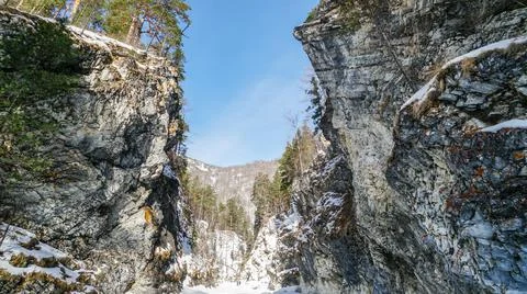 Deep Gorge in Winter. River Canyon Covered with Snow Stock Photos