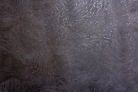 Deep gray texture resembling rough stone or metallic painted surface Stock Photos