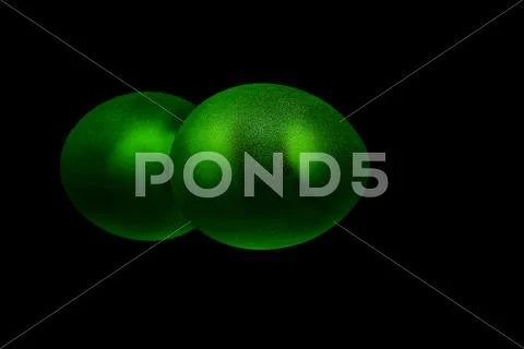 Deep green egg shaped object isolated on black Stock Photos