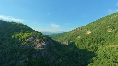 Deep green valley stretches beneath bright blue skies. Leskovac, Timelapse Stock Footage 341130162