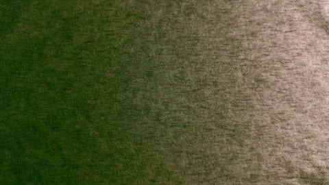 Deep green woven textile texture displaying warm bronze gradient highlighting Stock Photos