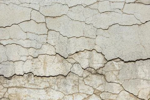 Deep horizontal cracks on old wall plaster - full-frame texture and background Stock Photos
