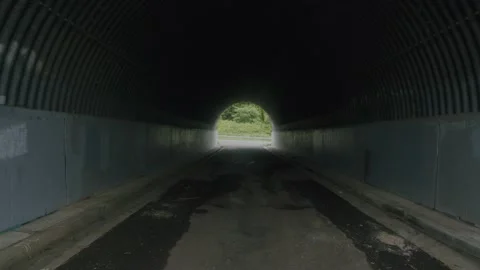 Deep Inside abandoned road tunnel 4K Stock Footage 168274454