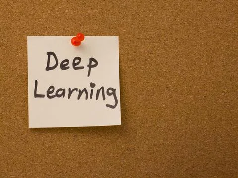 Deep learning concept handwritten on a note pinned to a cork board Stock Photos