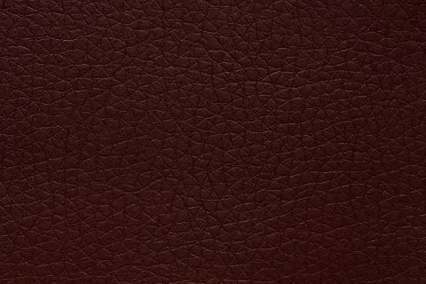 Deep leather texture in exciting colour. Dark brown leather background. Stock Photos