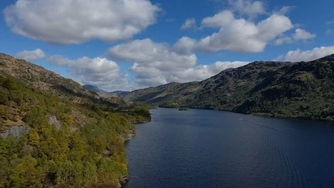 Deep Loch and Mountains, with Ben Lomond behind on a sunny day at Loch Lomond Stock Footage 108554759