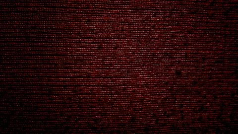 Deep maroon velvet fabric texture macro shot revealing intricate fibers and l 写真素材