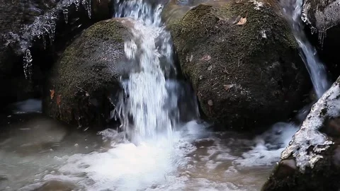 Deep mountain stream flowing among rocks covered with moss Stock Footage 148198070