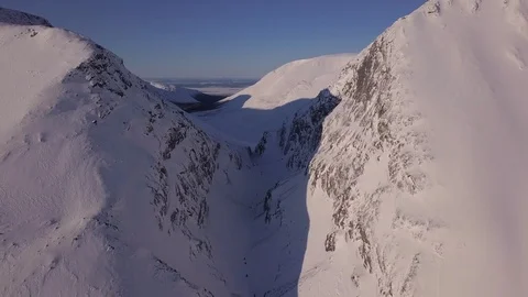 Deep narrow ravine under large mountain shadow aerial Stock-Footage 112535617