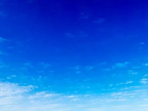 Deep Oman beach sky overcasted with clouds, blue sky with fainted and dispers Stock Photos