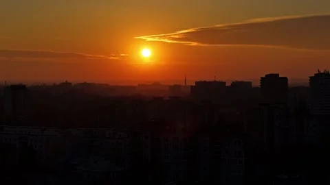 Deep orange sunset over silhouette of Kaunas city buildings, aerial time lapse Video stock 307507199
