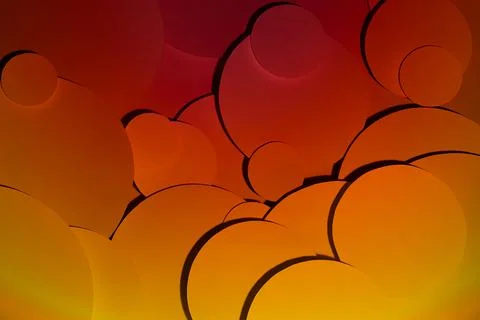 Deep orange yellow red abstract background of fly paper circles pattern of di Stock Photos