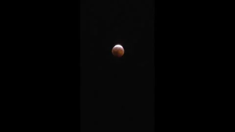 Deep Partial Lunar Eclipse Observed Across Americas and Europe 6 Stock Footage 343904090