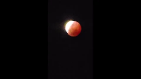 Deep Partial Lunar Eclipse Observed Across Americas and Europe 8 Stock Footage 343906209