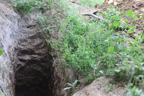 Deep pit in the ground Stock Photos