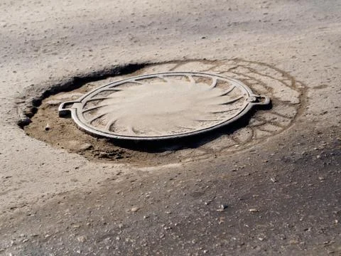 Deep pit on the road 스톡 사진