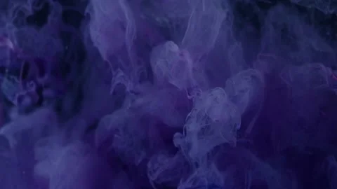 Deep purple paint on a black background Stock Footage 157096053