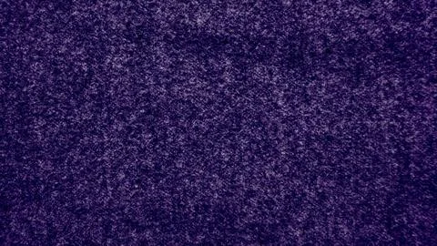 Deep purple speckled wool texture closeup granular mottled fabric surface evo Foto stock
