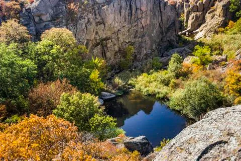 Deep quarry and river Stock Photos