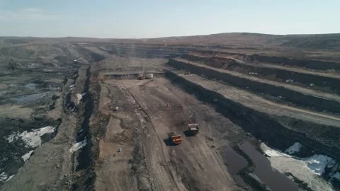 Deep quarry with working equipment. Mining machines. Excavator, dump truck Stock Footage 203918004