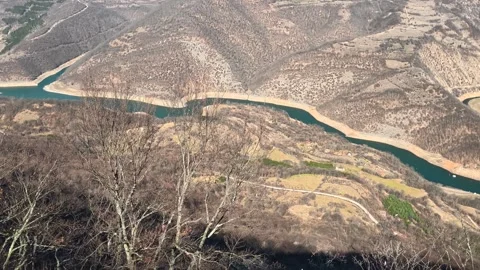 Deep ravine cuts through rugged, rocky terrain. Balkan, Eastern Europe, POV Video stock 331814014