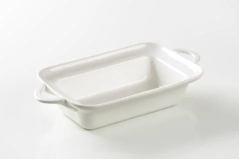Deep rectangular white ceramic dish with handles 스톡 사진