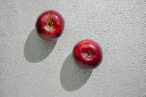 A deep red apple isolated on a clean white background, symbolizing health, .. Stock Photos