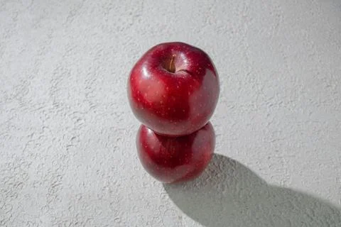 A deep red apple isolated on a clean white background, symbolizing health, .. Stock Photos