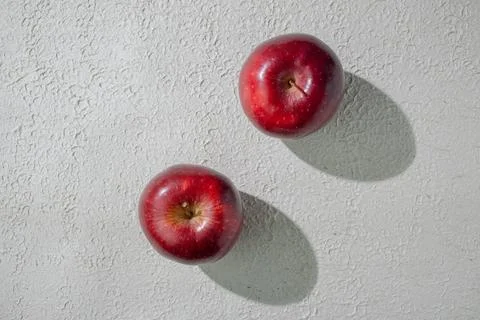 A deep red apple isolated on a clean white background, symbolizing health, .. Stock Photos