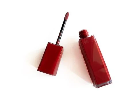 Deep red lip vinyl with applicator wand Stock Photos