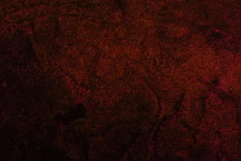 Deep red textured background with dark shadows and subtle pink highlights 写真素材