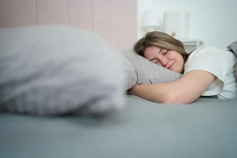 Deep Rest Under Warm Bedding on a Sick Day Stock Photos