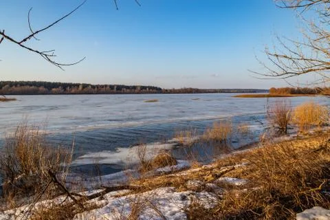 Deep river on the eve of ice drift in the spring in March. Stock Photos
