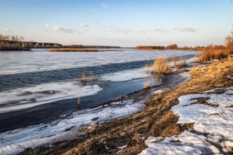 Deep river on the eve of ice drift in the spring in March. Stock Photos