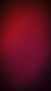 Deep ruby red and burgundy abstract grainy background with vertical gradien.. Stock Photos